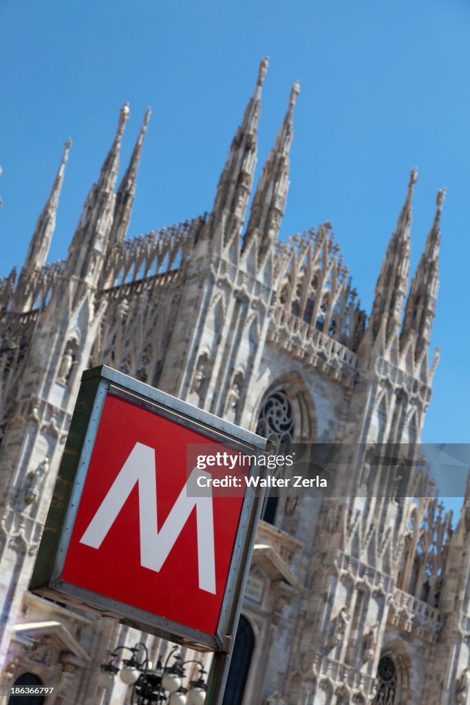 M' sign outside ornate church