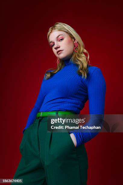 fashionable woman on plain background - pullover mit stehkragen stock-fotos und bilder