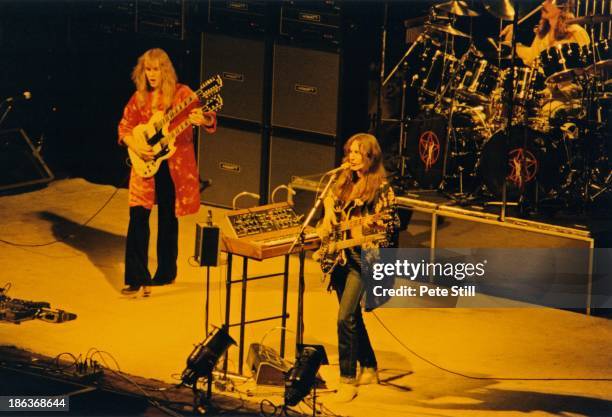 Alex Lifeson, Geddy Lee and Neil Peart of Rush perform on stage at Hammersmith Odeon, on February 20th, 1978 in London, England.