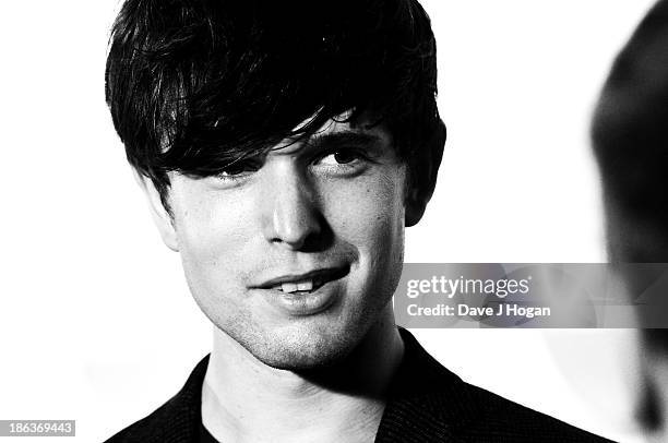 James Blake poses in front of the winners boards during the Barclaycard Mercury Prize 2013 at The Roundhouse on October 30, 2013 in London, England.