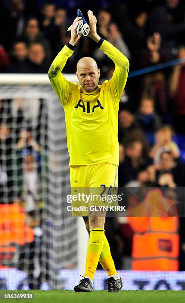 Tottenham Hotspur's US goalkeeper Brad Friedel celebrates after saving Hull City's Egyptian midfielder Ahmed Elmohamady's penalty during the penalty...