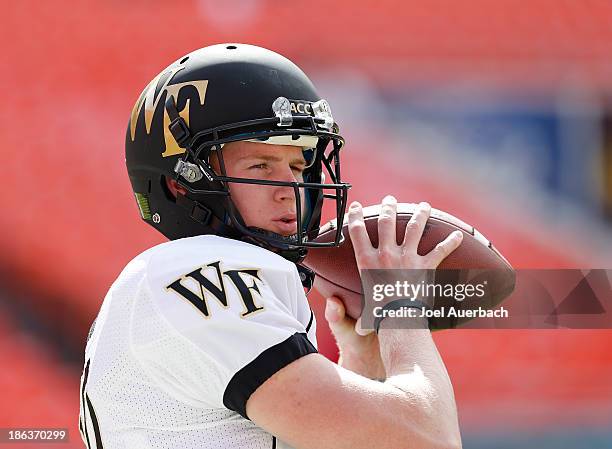 Tanner Price of the Wake Forest Demon Deacons throws the ball prior to the game against the Miami Hurricanes on October 26, 2013 at Sun Life Stadium...