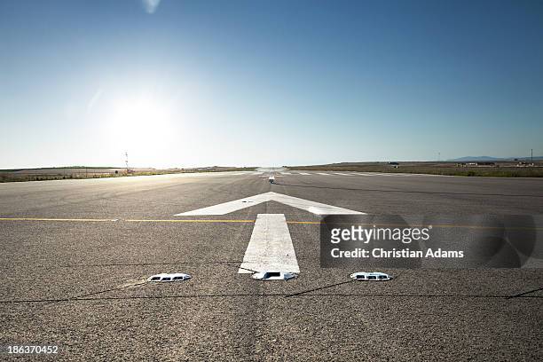 airfield at sunset - road front view stock pictures, royalty-free photos & images