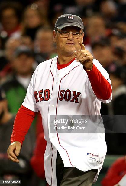 Former Boston Red Sox player Carlton Fisk reacts before throwing out the ceremonial first pitch prior to Game Six of the 2013 World Series between...