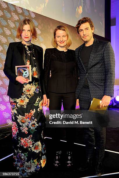 Mia Castenskjold and Ania Wiacek, winners of the Menswear Design Team award, and Robert Konjic pose onstage at The WGSN Global Fashion Awards at the...