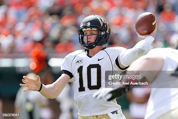Tanner Price of the Wake Forest Demon Deacons throws the ball against the Miami Hurricanes on October 26, 2013 at Sun Life Stadium in Miami Gardens,...