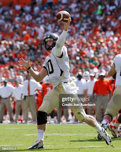 Tanner Price of the Wake Forest Demon Deacons throws the ball against the Miami Hurricanes on October 26, 2013 at Sun Life Stadium in Miami Gardens,...