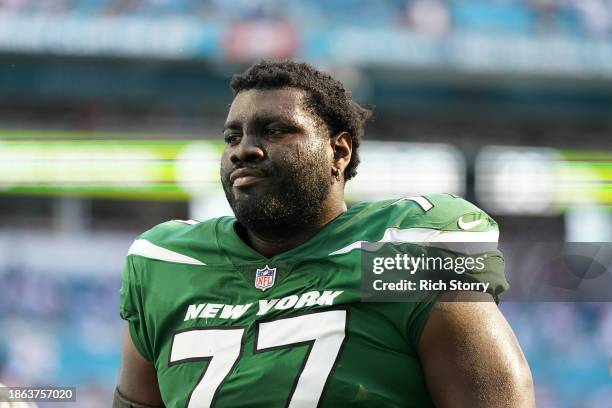 Mekhi Becton of the New York Jets exits the field at half time against the Miami Dolphins at Hard Rock Stadium on December 17, 2023 in Miami Gardens,...