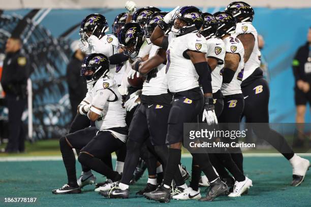 Members of the Baltimore Ravens defense celebrate after their fumble recovery against the Jacksonville Jaguars during the fourth quarter at EverBank...