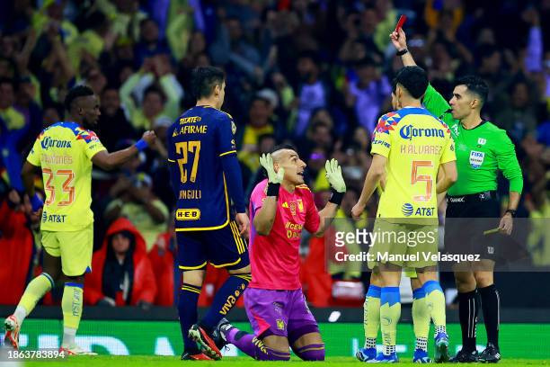 Referee Adonai Escobedo shows the red card to Nahuel Guzman during the final second leg match between America and Tigres UANL as part of the Torneo...