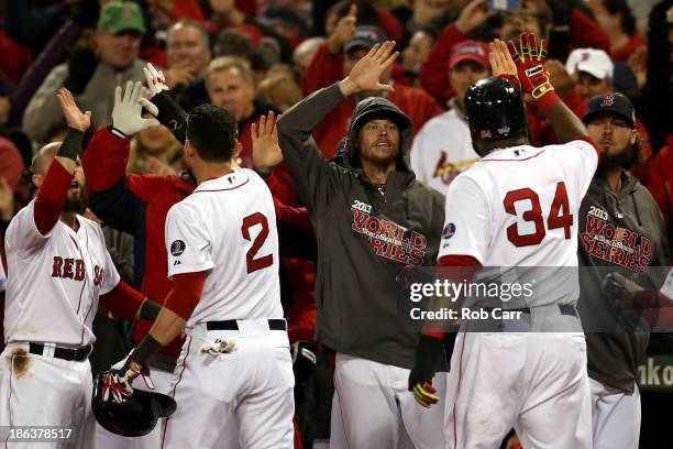David Ortiz and Jacoby Ellsbury of the Boston Red Sox return to the dugout after scoring in the third inning against the St. Louis Cardinals during...