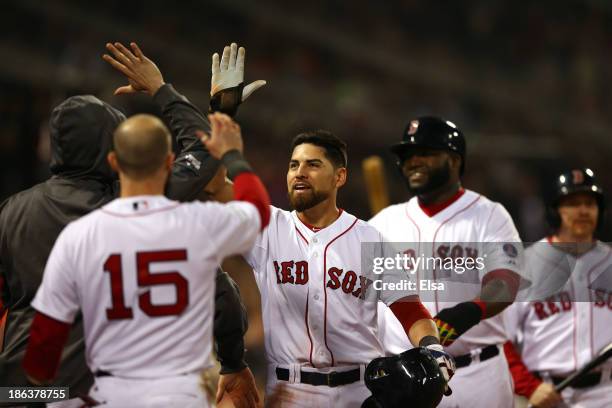 Jacoby Ellsbury of the Boston Red Sox returns to the dugout after scoring in the third inning against the St. Louis Cardinals during Game Six of the...
