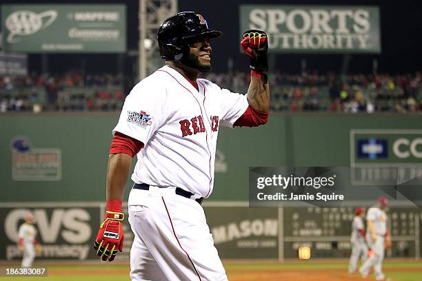 David Ortiz of the Boston Red Sox celebrates after scoring in the third inning against the St. Louis Cardinals during Game Six of the 2013 World...