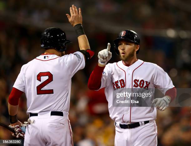 Stephen Drew celebrates with Jacoby Ellsbury of the Boston Red Sox after hitting a home run in the fourth inning against the St. Louis Cardinals...