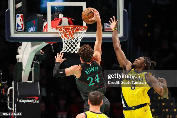 Corey Kispert of the Washington Wizards goes to the basket against Jarace Walker of the Indiana Pacers during the second half at Capital One Arena on...