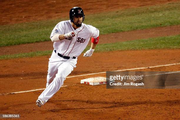 Shane Victorino of the Boston Red Sox rounds the bases after hitting a three run double in the third inning against the St. Louis Cardinals during...
