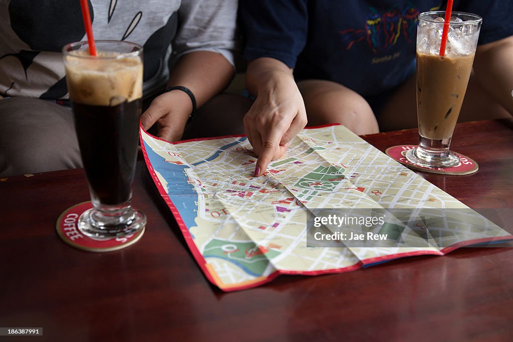 Pointing at map. Ho Chi Minh, Vietnam