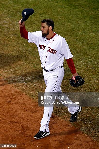 John Lackey of the Boston Red Sox tips his cap after being pulled in the seventh inning against the St. Louis Cardinals during Game Six of the 2013...