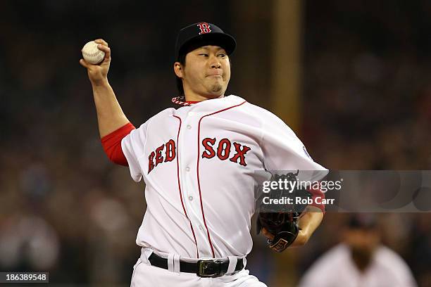 Junichi Tazawa of the Boston Red Sox pitches against the St. Louis Cardinals in the seventh inning of Game Six of the 2013 World Series at Fenway...