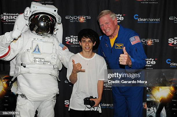 Actor Moises Arias and astronaut Jon McBride pose during the "Ender's Game" special screening hosted by Kennedy Space Center and Clear Channel at...