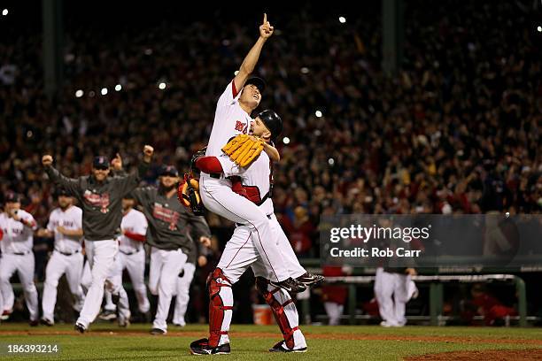 Koji Uehara of the Boston Red Sox celebrates with David Ross after defeating the St. Louis Cardinals 6-1 in Game Six of the 2013 World Series at...