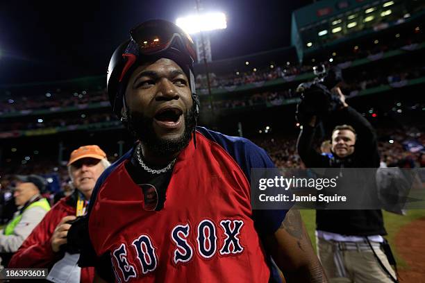 David Ortiz of the Boston Red Sox celebrates after defeating the St. Louis Cardinals 6-1 in Game Six of the 2013 World Series at Fenway Park on...