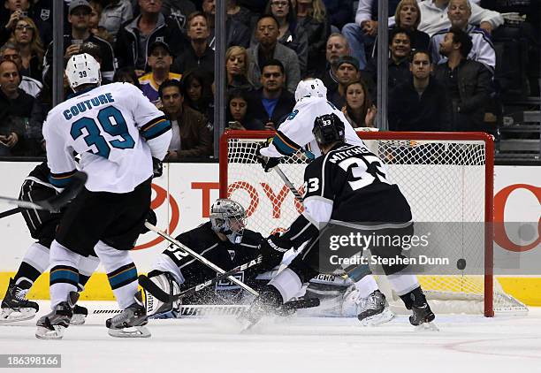 Logan Couture of the San Jose Sharks watches as his shot gets by goalie Jonathan Quick of the Los Angeles Kings for a second period power play goal...