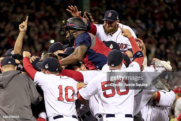 The Boston Red Sox celebrate after defeating the St. Louis Cardinals in Game Six of the 2013 World Series at Fenway Park on October 30, 2013 in...