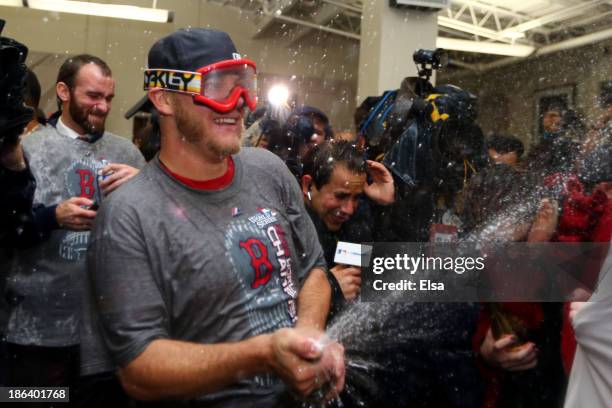 Jake Peavy of the Boston Red Sox celebrates in the locker room after defeating the St. Louis Cardinals 6-1 in Game Six of the 2013 World Series at...