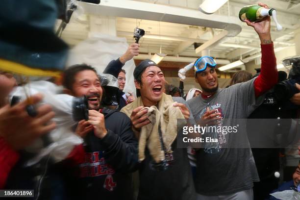 Koji Uehara and Felix Doubront of the Boston Red Sox celebrate in the locker room after defeating the St. Louis Cardinals 6-1 in Game Six of the 2013...