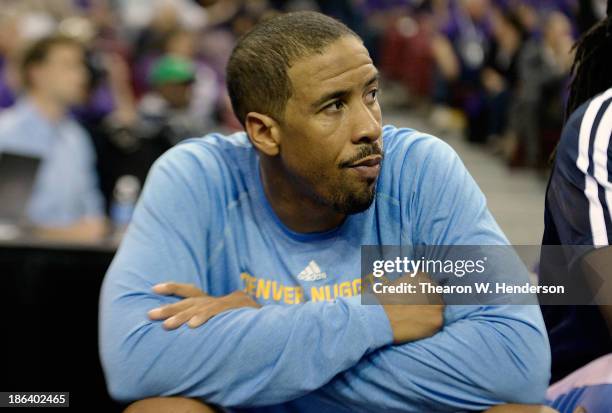 Andre Miller of the Denver Nuggets takes a looks on from the bench against the Sacramento Kings late in the fourth quarter at Sleep Train Arena on...