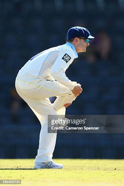 Blues captain Michael Clarke stretches during day two of the Sheffield Shield match between the New South Wales Blues and the Tasmanian Tigers at...