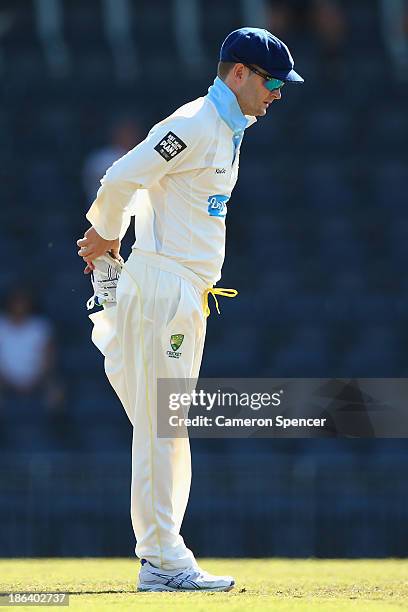 Blues captain Michael Clarke stretches during day two of the Sheffield Shield match between the New South Wales Blues and the Tasmanian Tigers at...