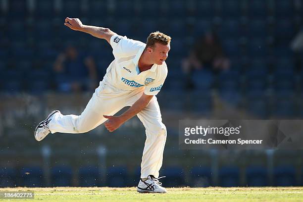 Doug Bollinger of the Blues bowls during day two of the Sheffield Shield match between the New South Wales Blues and the Tasmanian Tigers at...