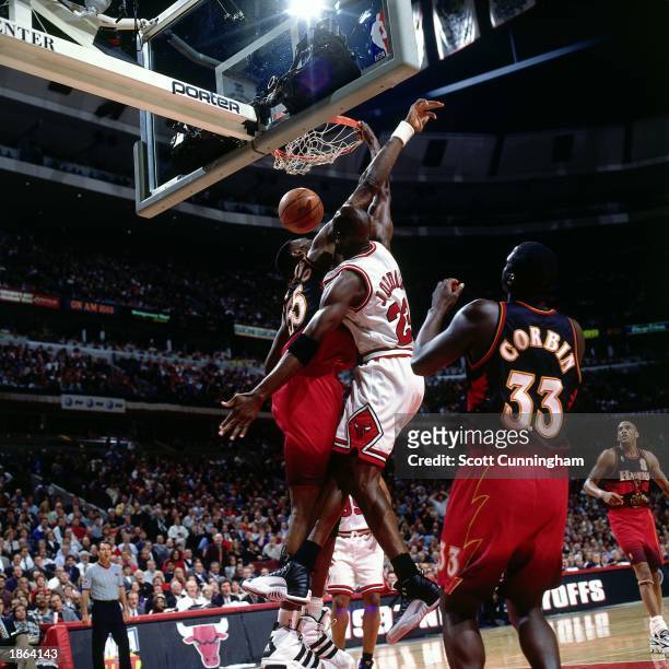 Michael Jordan of the Chicago Bulls dunks against the Atlanta Hawks during Game Five, round two of the 1997 NBA Playoffs at the United Center in...