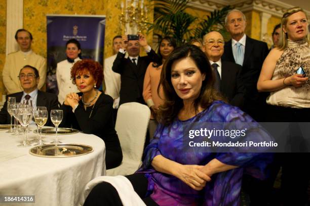 Italian actress and singer Maria Scicolone and French-born Italian actress and producer Edwige Fenech sitting among the guests during the reception...