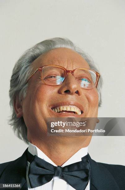 Italian singer-songwriter, stand-up comedian and actor Enzo Jannacci laughing. 1990s.