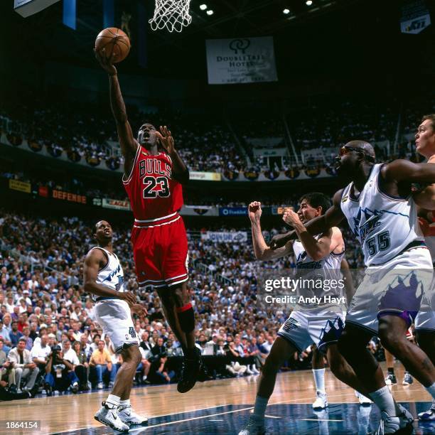 Michael Jordan of the Chicago Bulls drives to the basket against the Utah Jazz during Game Six of the 1998 NBA Championship Finals in Salt Lake City,...