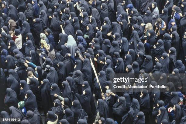 Veiled Iranian women protest during the Iranian Revolution. The Iranian population protests against the repressive regime of the Shah Mohammad Reza...