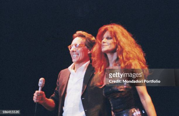 Italian singer-songwriter, stand-up comedian and actor Enzo Jannacci singing with Italian singer and actress Milva . 6th December 1989.