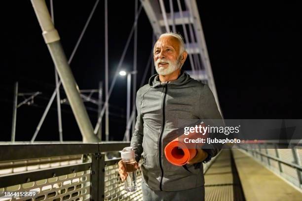 happy senior man finishing happy and losing weight with a cardio workout - durability stock pictures, royalty-free photos & images