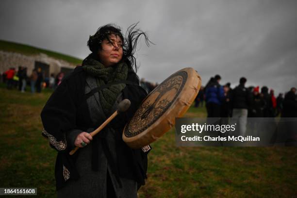 People take part in a sun rise ceremony during the Winter Solstice at Newgrange on December 21, 2023 in Newgrange, Ireland. Newgrange, a...