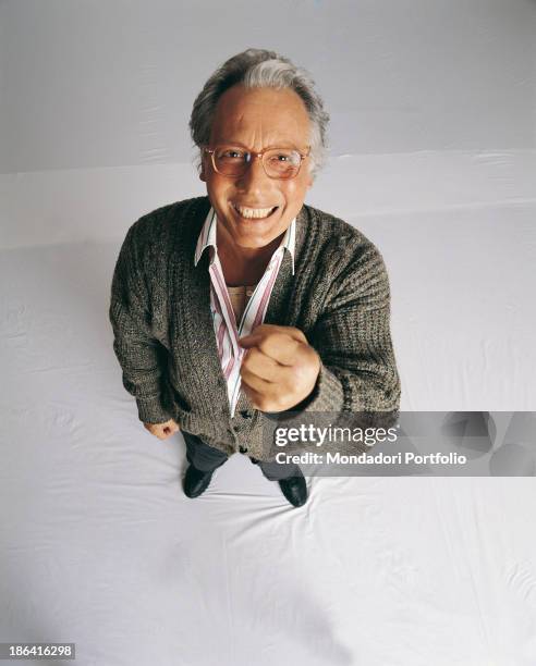 Italian singer-songwriter, stand-up comedian and actor Enzo Jannacci smiling and raising his fist. The singer-songwriter takes part in the 48th...