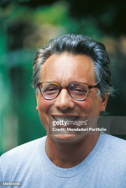 Italian singer-songwriter, stand-up comedian and actor Enzo Jannacci smiling. The singer-songwriter celebrates his thirty-year career. 1989.