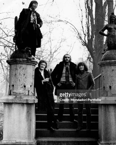 The Italian music group Equipe 84 next to the cast iron statues representing two mermaids of the Bridge of the Mermaids in the heart of Parco...
