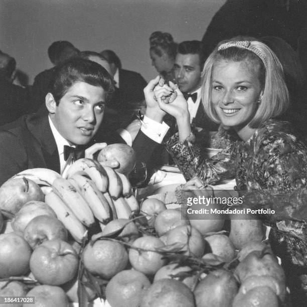 Canadian singer and composer Paul Anka and his wife, Lebanese-born British model Anne de Zogheb, holding hands smiling during the 14th Sanremo Music...