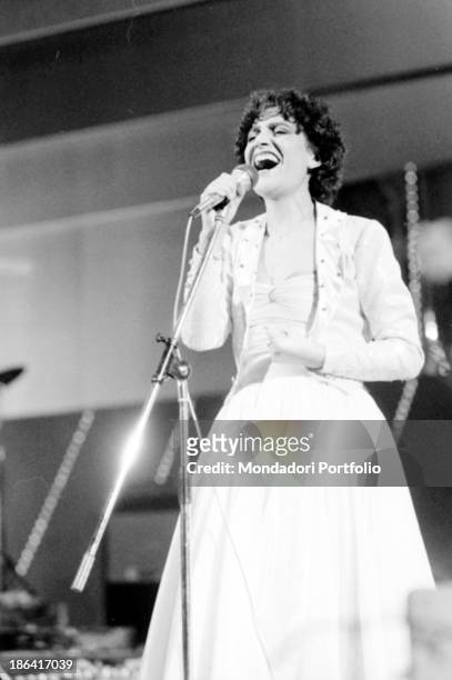 Italian singer Mia Martini singing E non finisce mica il cielo at the 32nd Sanremo Music Festival. Sanremo, January 1982.