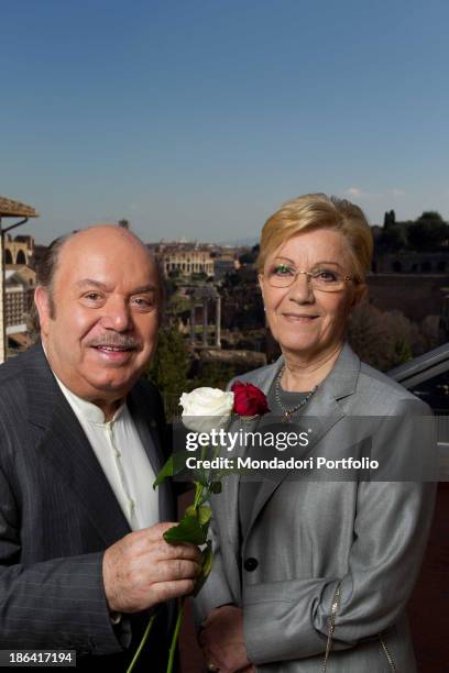 Italian actor and comedian Lino Banfi offering two roses to his wife Lucia. The couple celebrated their 50th wedding anniversary making the wedding...