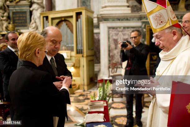 Italian actor and comedian Lino Banfi receiving the wedding ring from his wife Lucia during the ceremony officiated by Italian cardinal and...