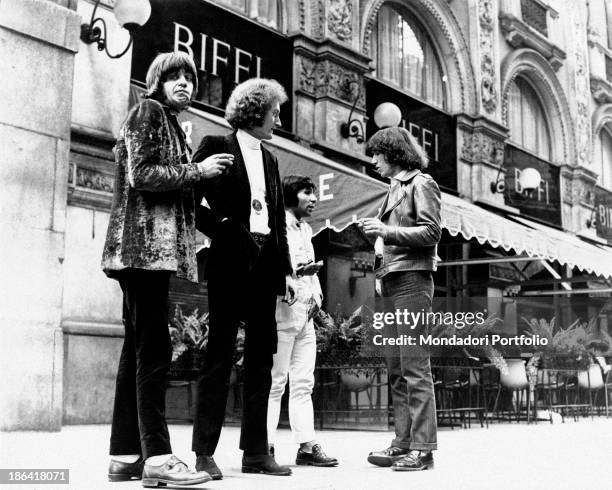 The members of the Italian music group Equipe 84 are chatting under the Galleria Vittorio Emanuele II shopping mall in Milan, in front of the Café...